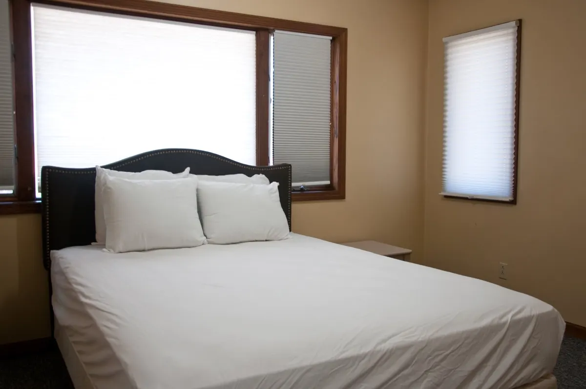 Duplex bedroom with a queen bed